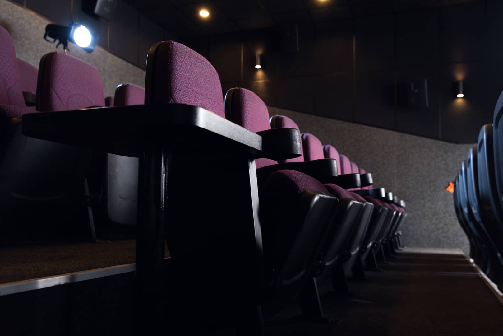 red-seats-in-empty-dark-movie-theater